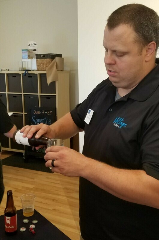 man pouring beer