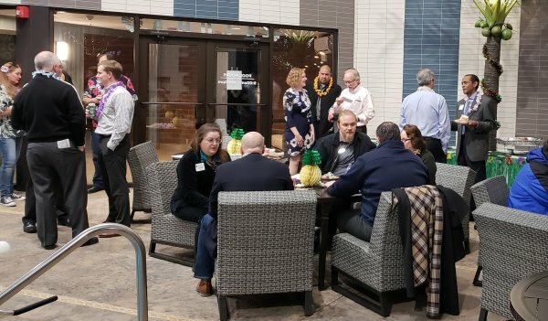 People sitting and standing in lobby